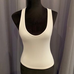 Sexy white tank top ONE SIZE. NEW; NEVER WORN.